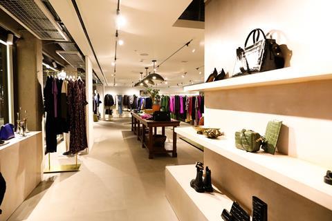 Interior of Jigsaw store, Battersea Power Station, showing womenswear displays